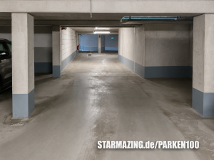 Helle und gepflegte Innenansicht der Tiefgarage in der Nesselrodestraße, Mönchengladbach mit markierten Stellplätzen.