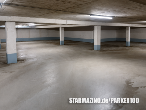 Helle und gepflegte Innenansicht der Tiefgarage in der Nesselrodestraße, Mönchengladbach mit markierten Stellplätzen.